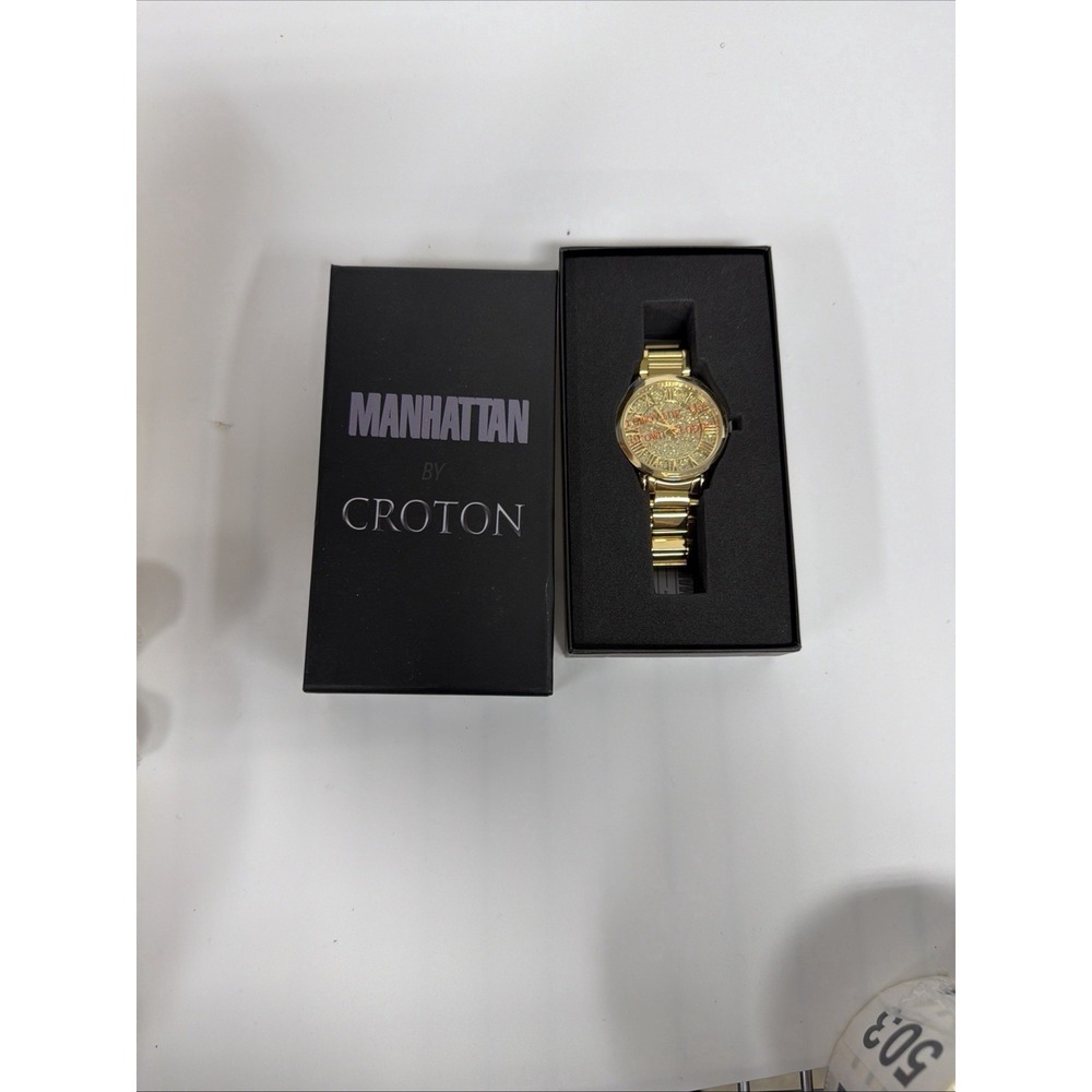 Manhattan by Croton wristwatch featuring a gold-tone‎ band